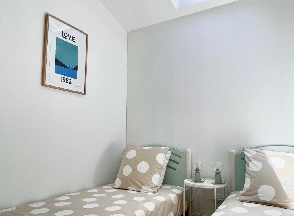 Posteľ alebo postele v izbe v ubytovaní Villa au calme avec jardin, parking, clim, proche de tout !