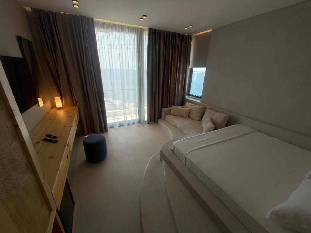 Postel nebo postele na pokoji v ubytování Hotel Ble Ble Vlore