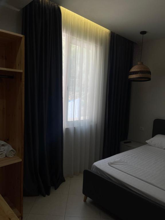 Postel nebo postele na pokoji v ubytování Hotel Ble Ble Vlore