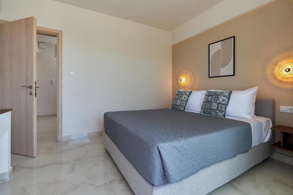 Postel nebo postele na pokoji v ubytování Mila Malia Suites