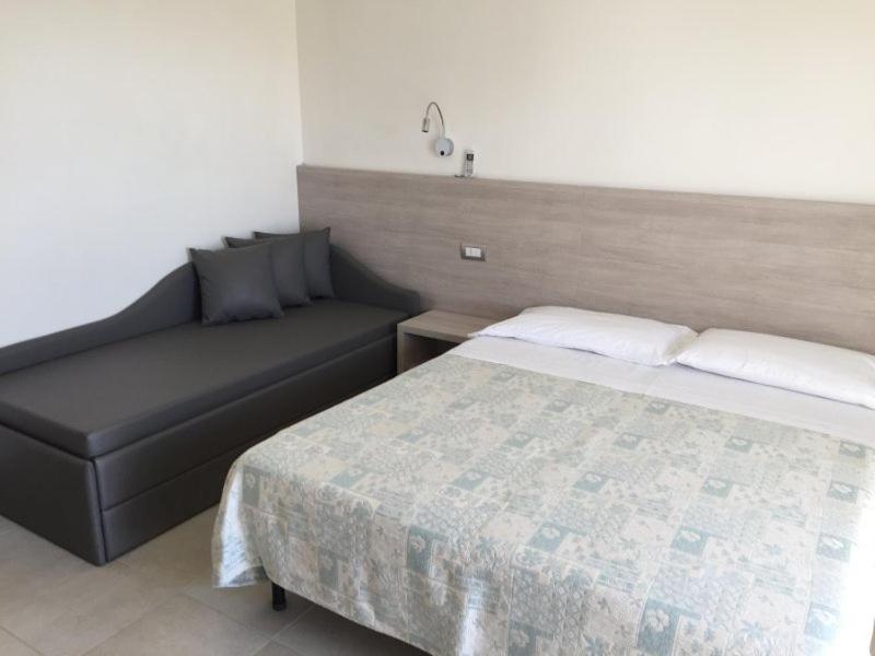 Postel nebo postele na pokoji v ubytování Hotel Astor