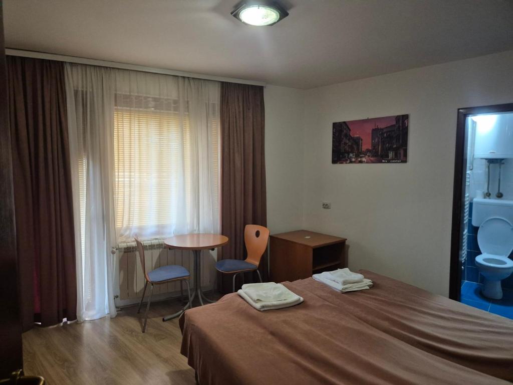 Postel nebo postele na pokoji v ubytování Sobe Rooms Aleksandar