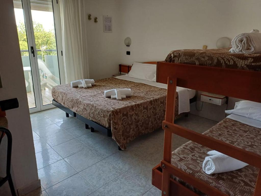 Postel nebo postele na pokoji v ubytování Dasamo Hotel - Dada Hotels
