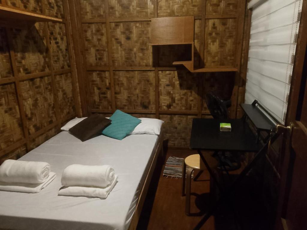 Postel nebo postele na pokoji v ubytování Coleto Siargao