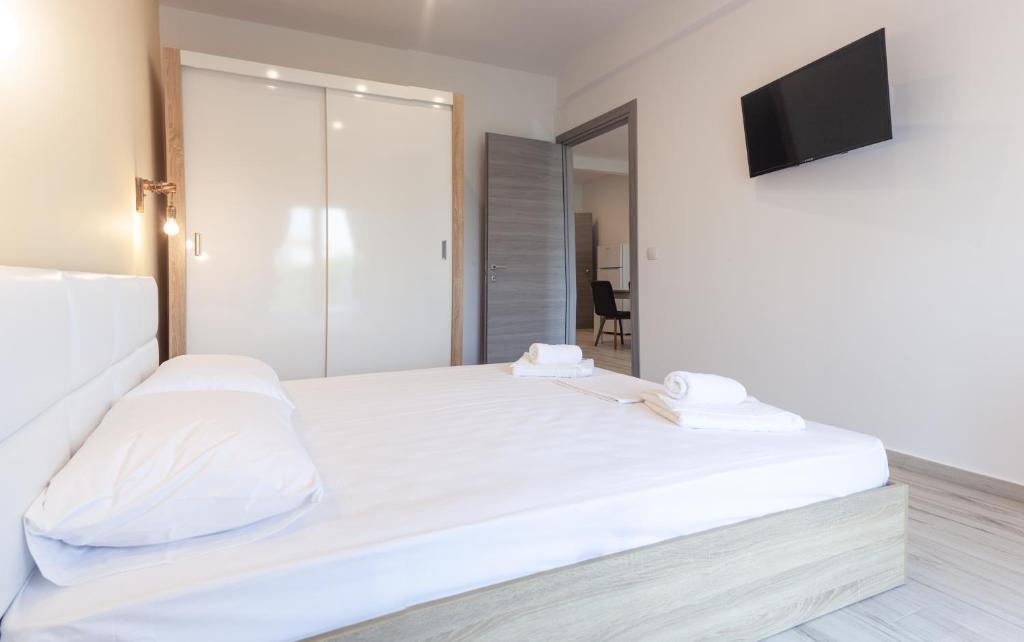 Postel nebo postele na pokoji v ubytování Diamanti Apartments Downtown Limenas Thasos