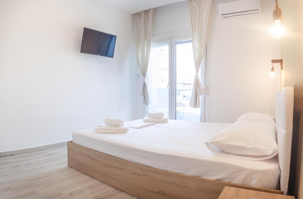 Postel nebo postele na pokoji v ubytování Diamanti Apartments Downtown Limenas Thasos