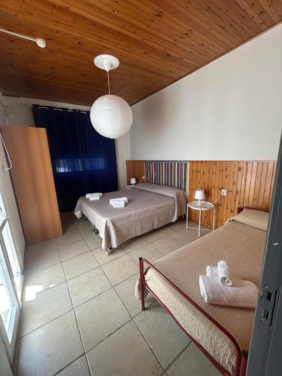 Postel nebo postele na pokoji v ubytování LUDO Holiday House