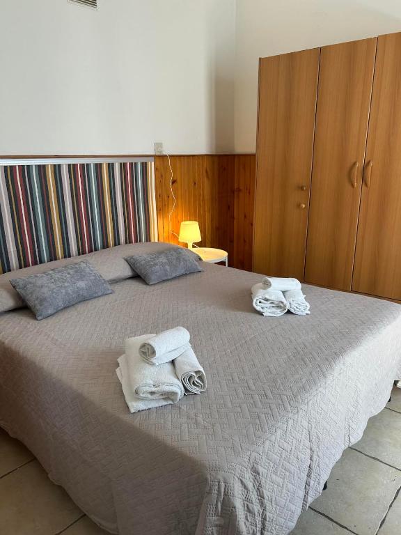 Postel nebo postele na pokoji v ubytování LUDO Holiday House