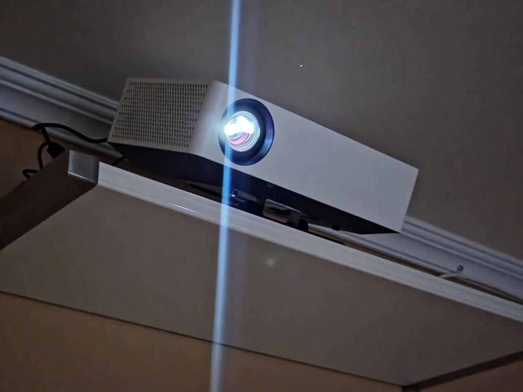 a tv on a ceiling with a light on it at Dongdaemun Myeongdong 6BED in Seoul