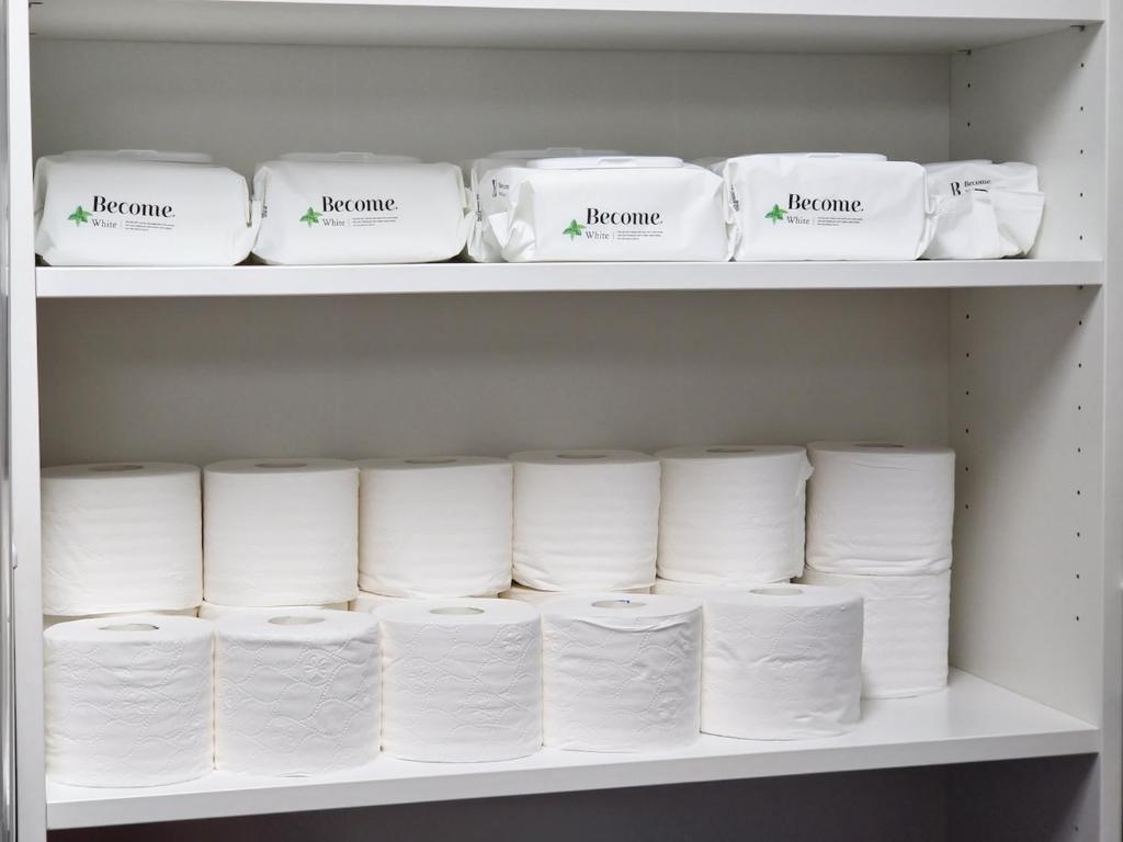 a shelf filled with lots of white toilet paper at Dongdaemun Myeongdong 6BED in Seoul