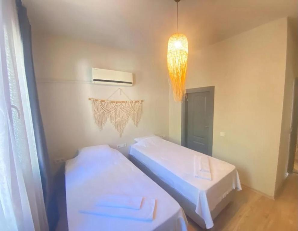 Postel nebo postele na pokoji v ubytování VERA HOTEL KAŞ