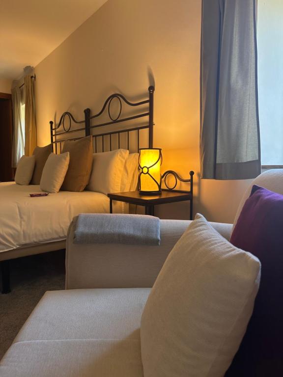 Posteľ alebo postele v izbe v ubytovaní Corzo Hotel