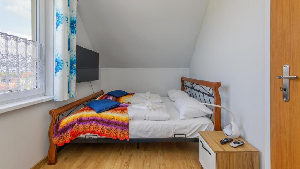 Posteľ alebo postele v izbe v ubytovaní Apartamenty Sun & Snow Rumiankowa
