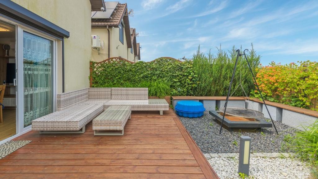 Vonkajšia záhrada v ubytovaní Apartamenty Sun & Snow Rumiankowa