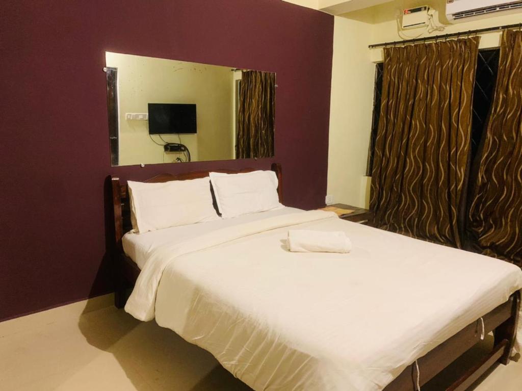Postel nebo postele na pokoji v ubytování Mehar Rooms
