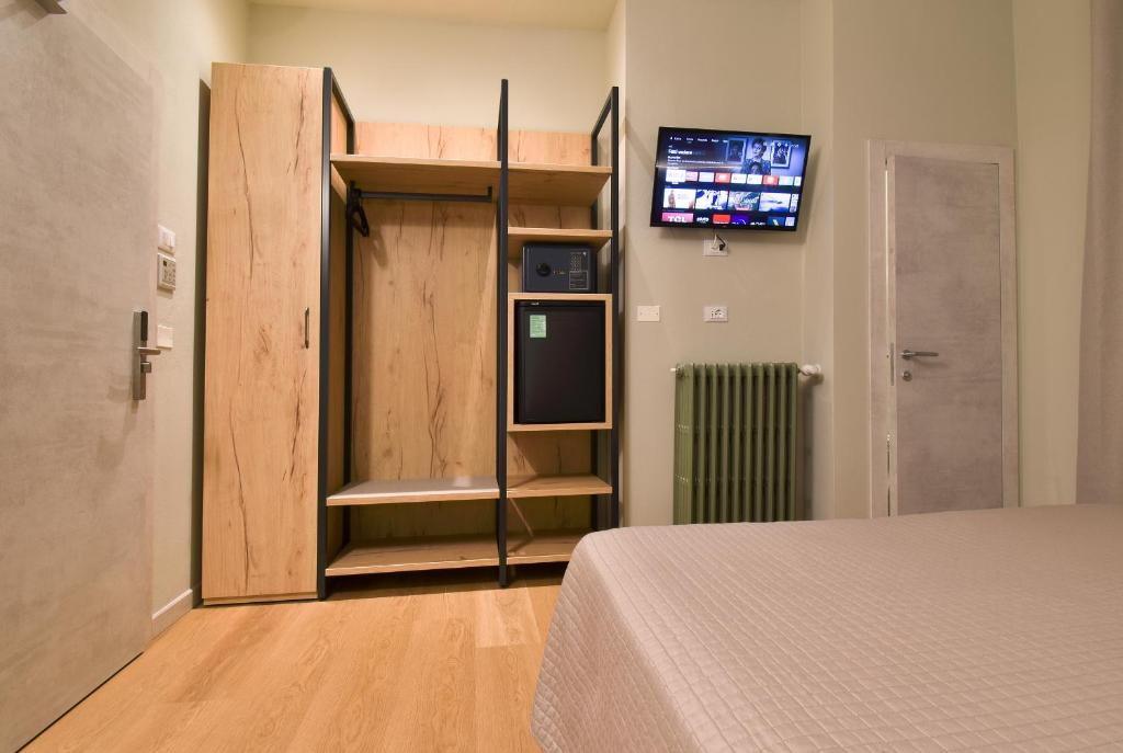 Posteľ alebo postele v izbe v ubytovaní Hotel Columbia