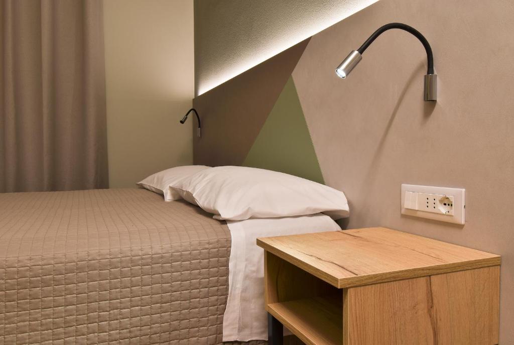 Posteľ alebo postele v izbe v ubytovaní Hotel Columbia