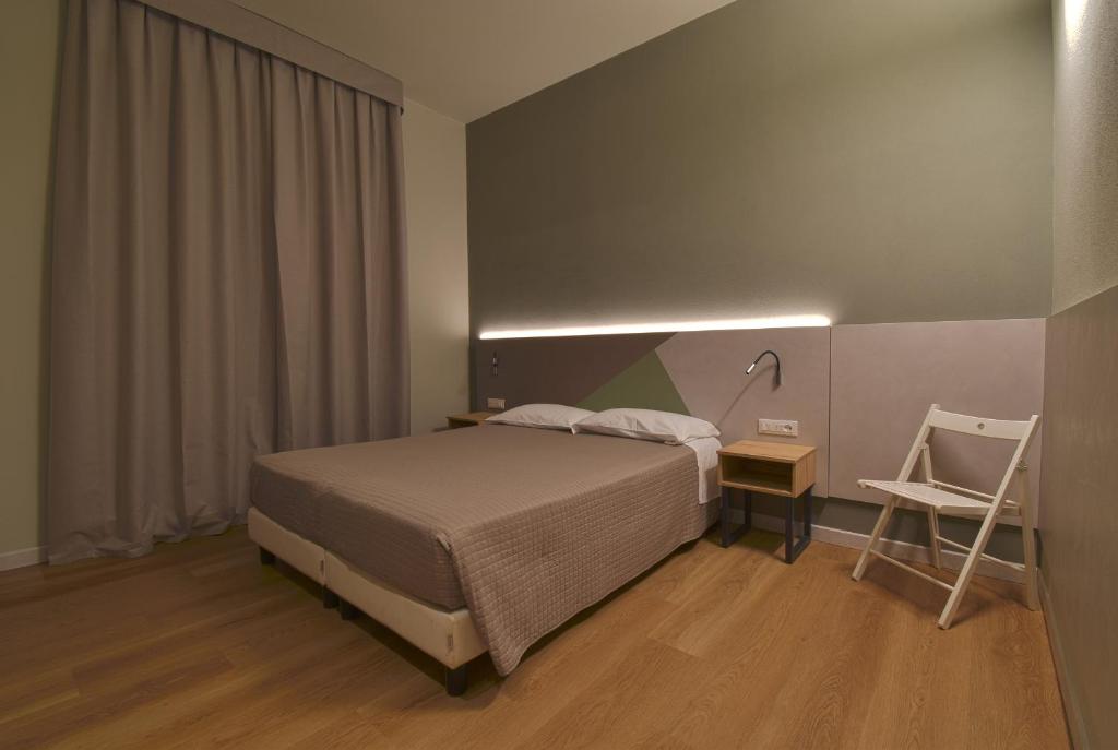 Posteľ alebo postele v izbe v ubytovaní Hotel Columbia