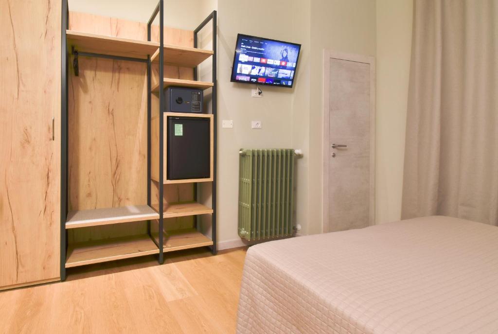Posteľ alebo postele v izbe v ubytovaní Hotel Columbia