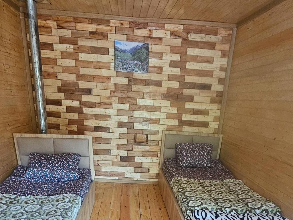 Postel nebo postele na pokoji v ubytování MURQVAMI Guesthouse