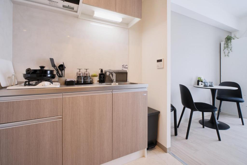 Kuchyň nebo kuchyňský kout v ubytování Junction Namba South Hotel Apartment ジャンクション難波南ホテルアパートメント