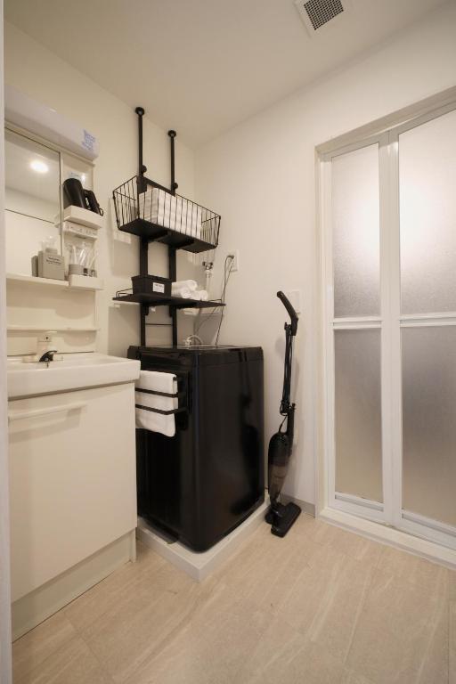 Kuchyň nebo kuchyňský kout v ubytování Junction Namba South Hotel Apartment ジャンクション難波南ホテルアパートメント