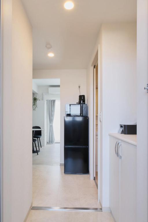 Kuchyň nebo kuchyňský kout v ubytování Junction Namba South Hotel Apartment ジャンクション難波南ホテルアパートメント