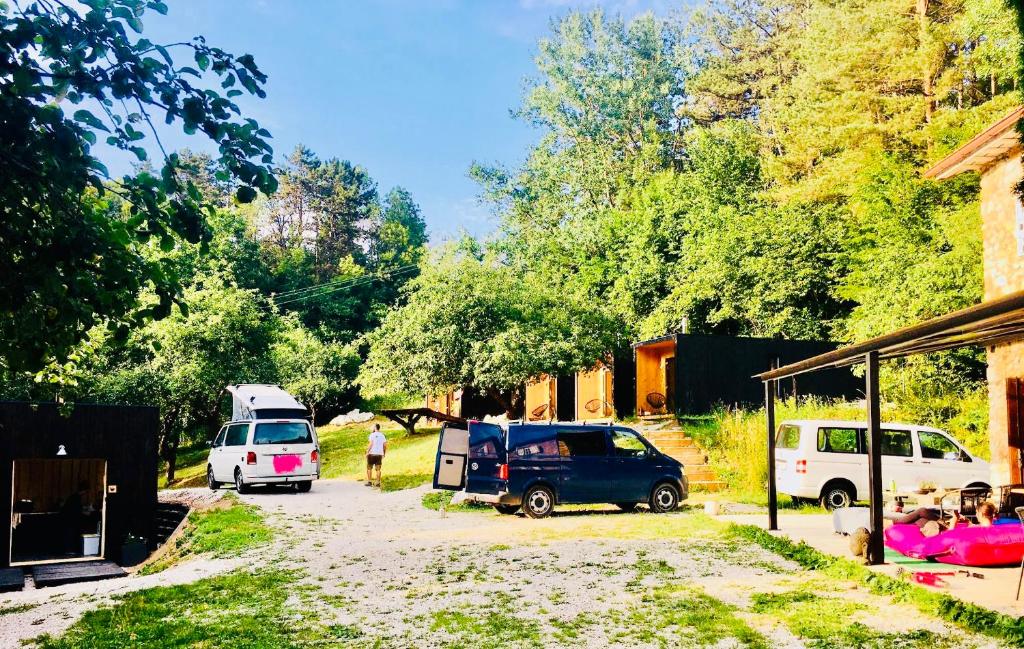 a group of cars parked in a parking lot at Camping centra Shambhala in Lúčka