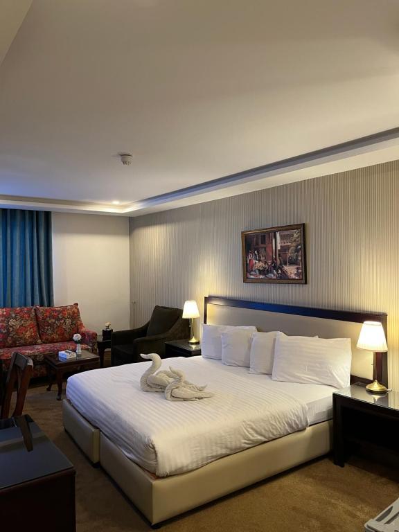 Postel nebo postele na pokoji v ubytování Strand Hotel Jordan