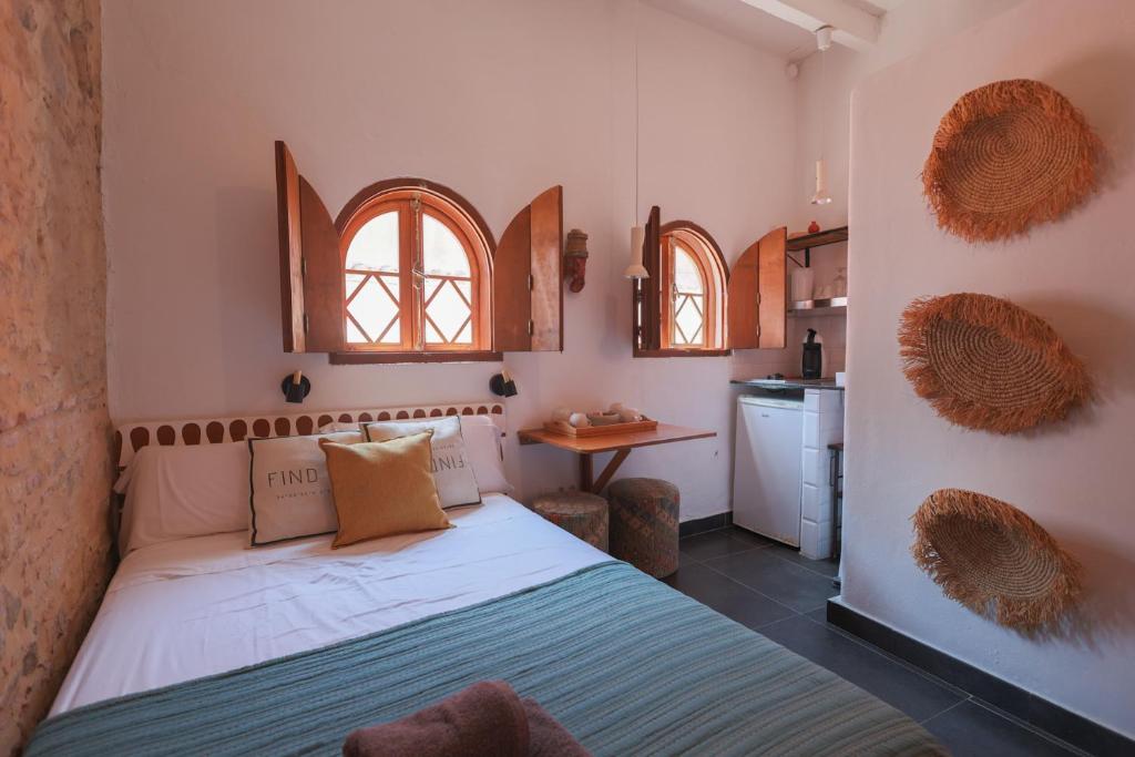 A bed or beds in a room at Koala Tarifa