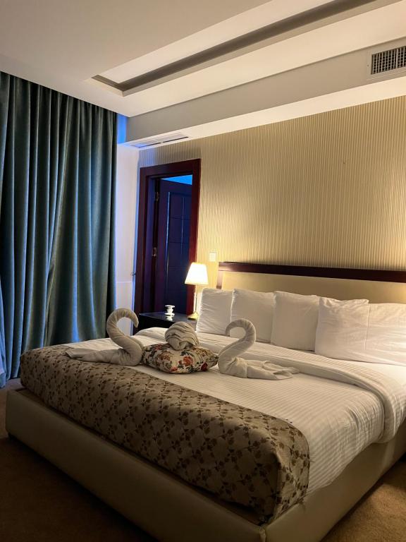 Postel nebo postele na pokoji v ubytování Strand Hotel Jordan