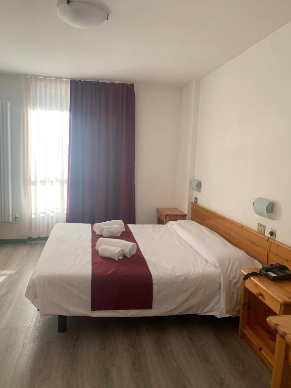 Postel nebo postele na pokoji v ubytování Hotel Fraiteve