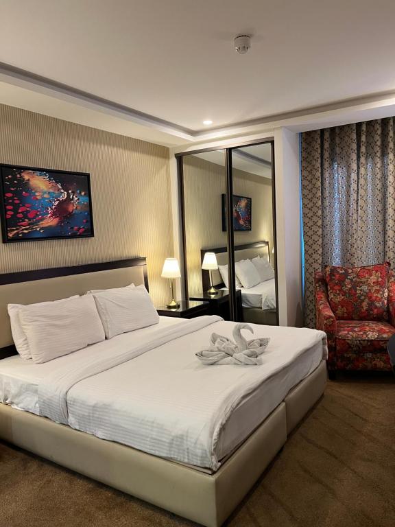 Postel nebo postele na pokoji v ubytování Strand Hotel Jordan