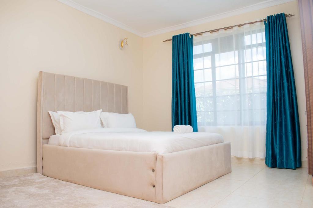 Postel nebo postele na pokoji v ubytování Eldoten suites