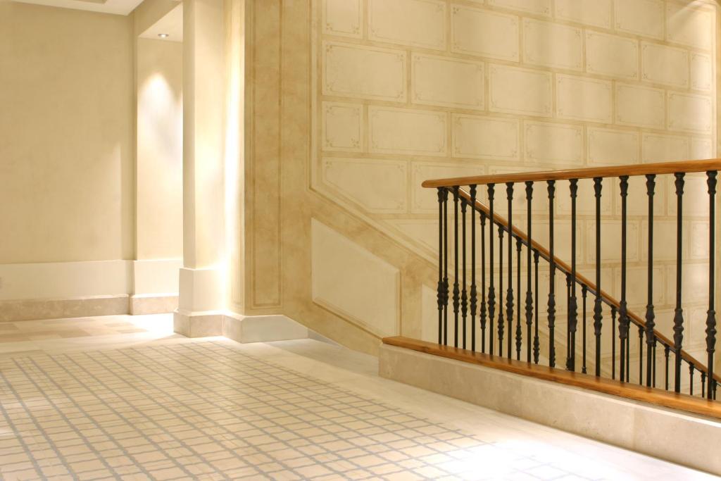 a hallway with a staircase with at Villa Oniria in Granada
