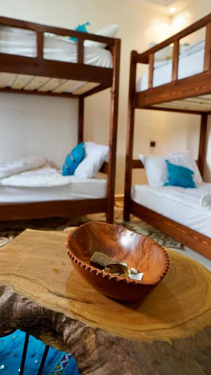 Postel nebo postele na pokoji v ubytování Dar Surf & Ocean