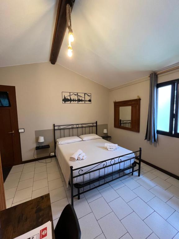 Postel nebo postele na pokoji v ubytování B&B Garzola