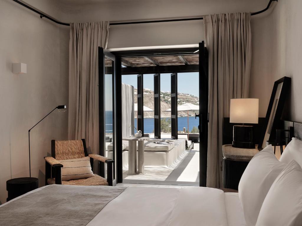 Postel nebo postele na pokoji v ubytování Kalesma Mykonos