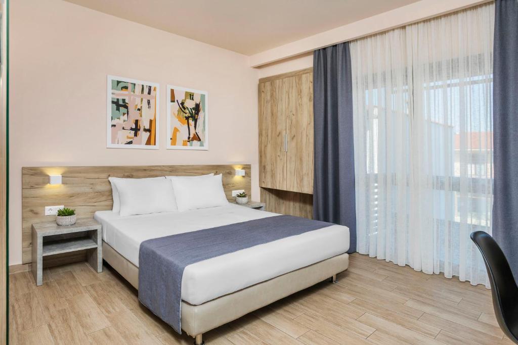 Łóżko lub łóżka w pokoju w obiekcie Hotel Vozina