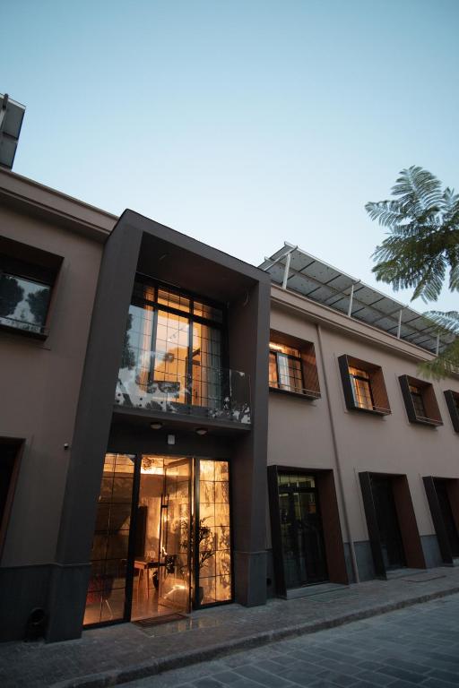 a building with large windows and a building at Palazzo Sebeto in Naples