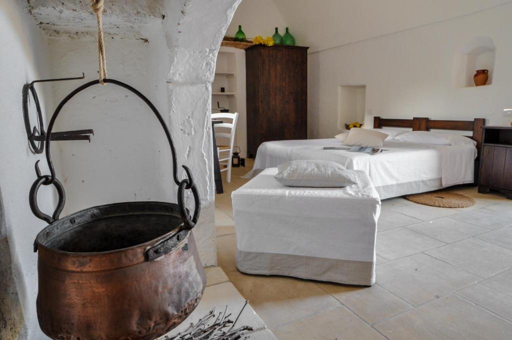 Postel nebo postele na pokoji v ubytování Masseria Uccio