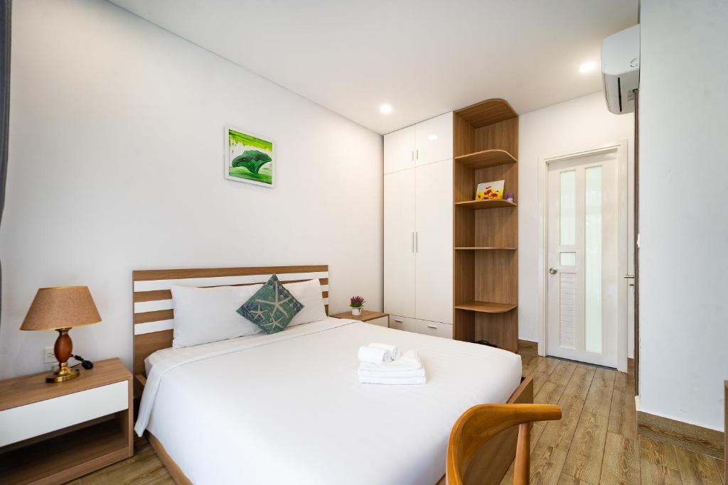 Postel nebo postele na pokoji v ubytování Phuc Lam Hotel Grand World Phu Quoc