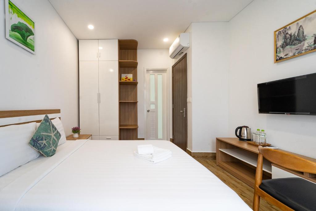 Postel nebo postele na pokoji v ubytování Phuc Lam Hotel Grand World Phu Quoc