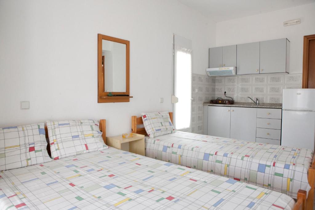 Postel nebo postele na pokoji v ubytování Flora Rooms