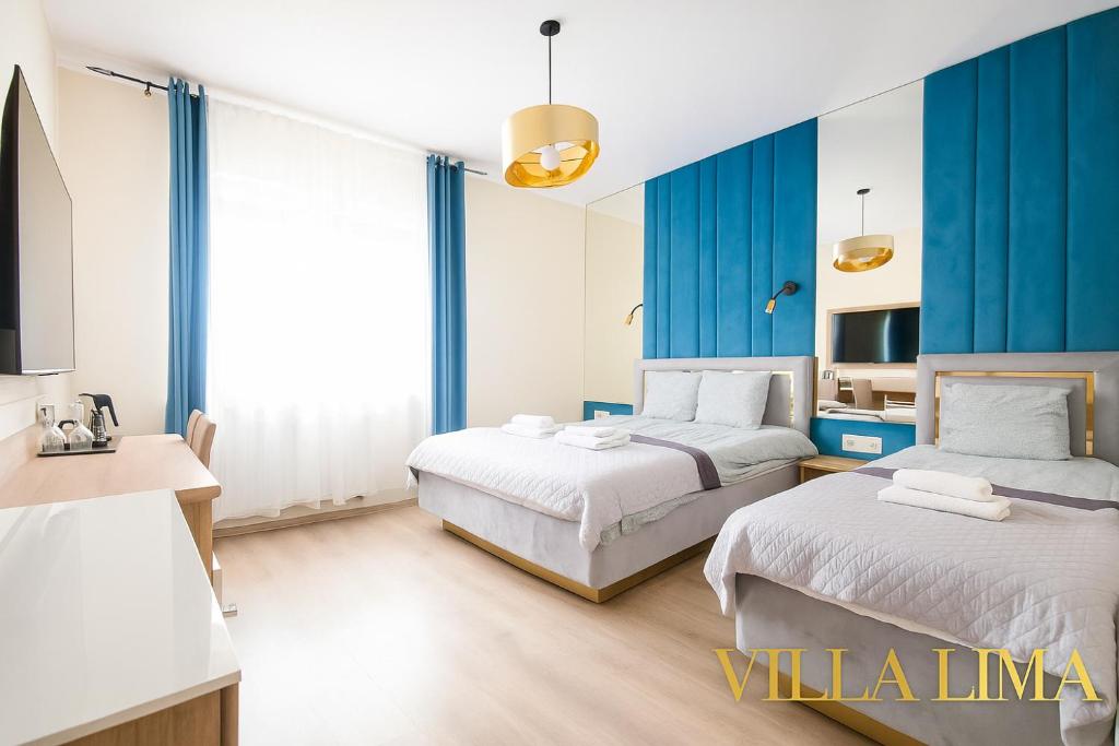 Postel nebo postele na pokoji v ubytování Villa Lima