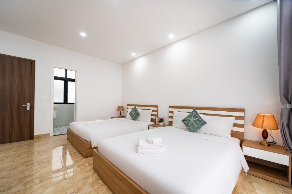 Postel nebo postele na pokoji v ubytování Phuc Lam Hotel Grand World Phu Quoc