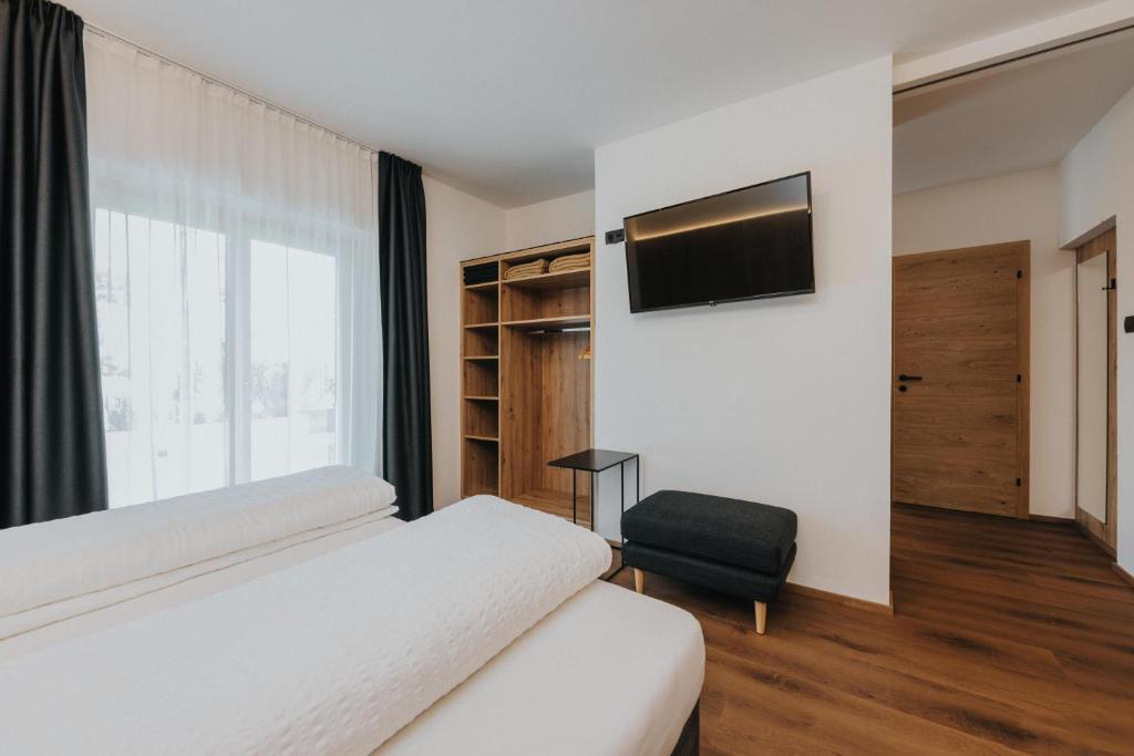 Postel nebo postele na pokoji v ubytování Hotel Bischofhof - Bistro Jasmin
