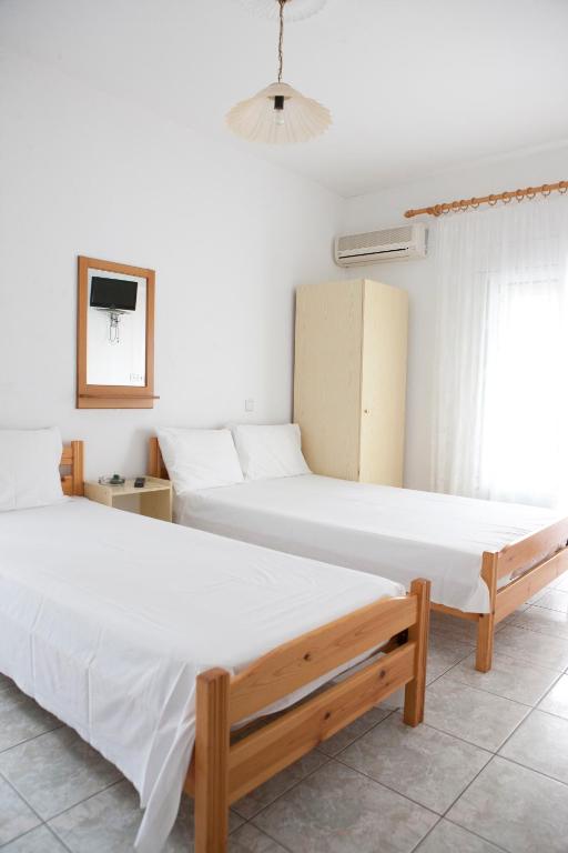 Postel nebo postele na pokoji v ubytování Flora Rooms
