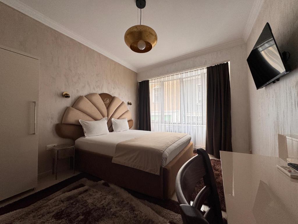 Postel nebo postele na pokoji v ubytování Hotel Dafi