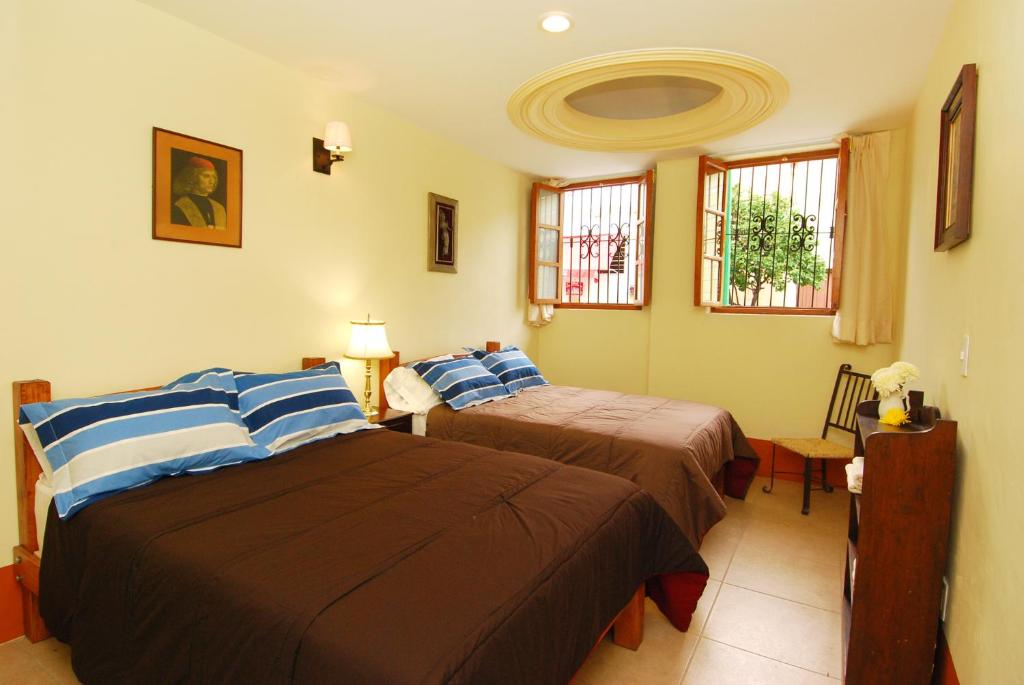 Postel nebo postele na pokoji v ubytování Olga Querida B&B Hostal